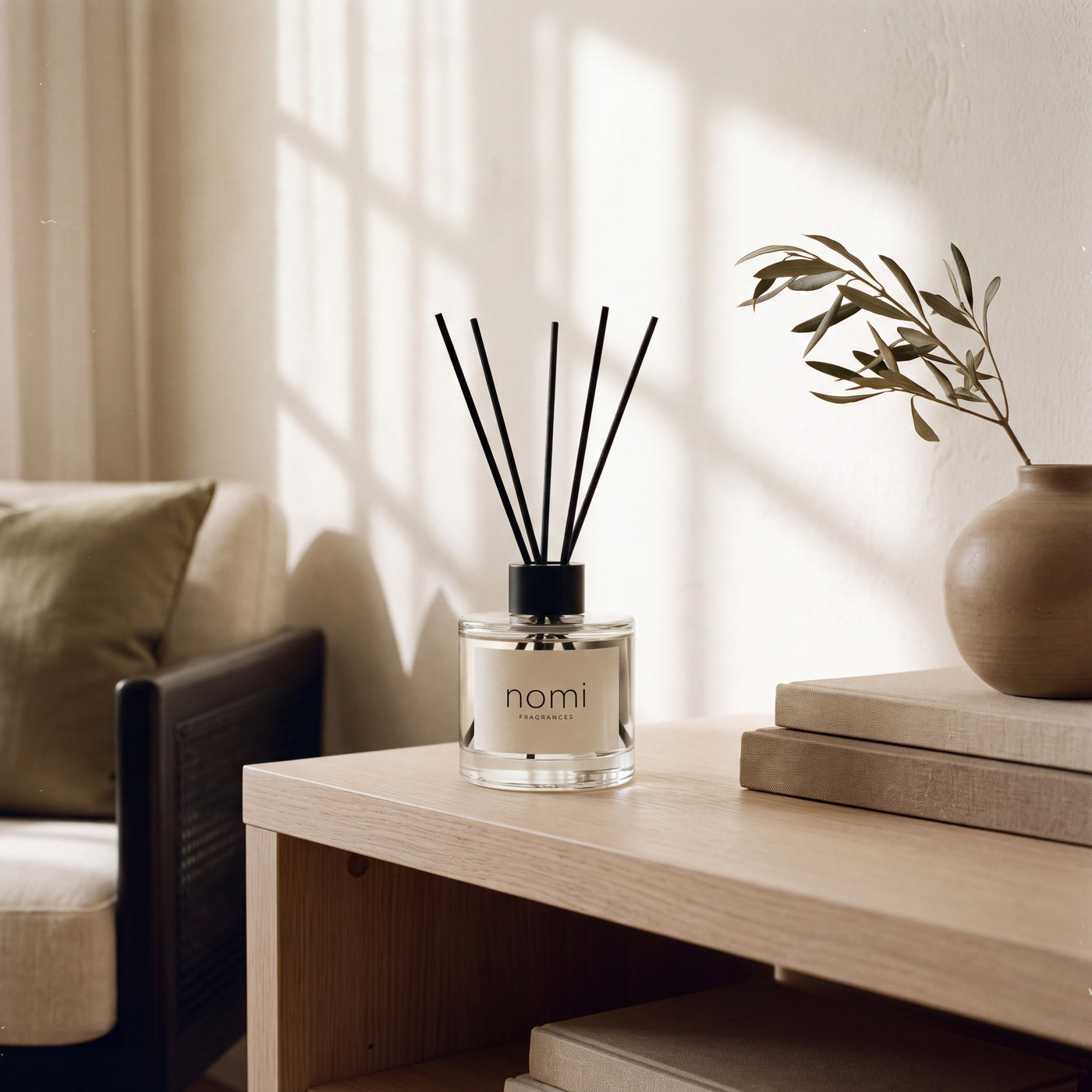 nomi reed diffuser styled in a warm minimal living room