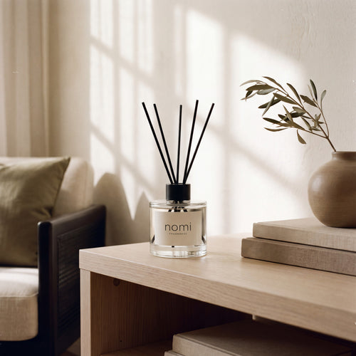 nomi reed diffuser styled in a warm minimal living room