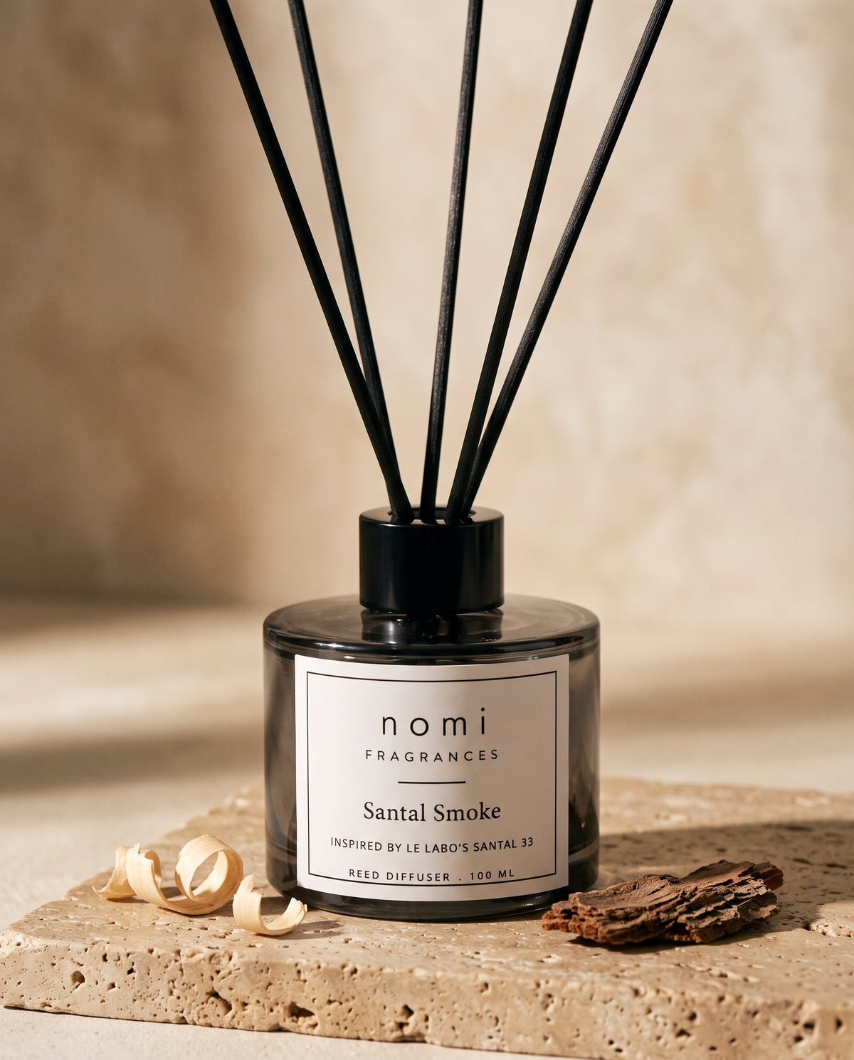 Santal Smoke reed diffuser round bottle close-up with sandalwood